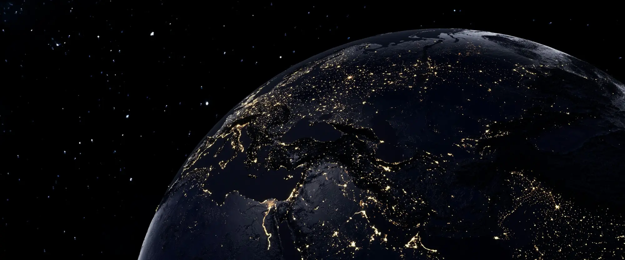 La Tierra de noche vista desde el espacio, con las luces de las ciudades